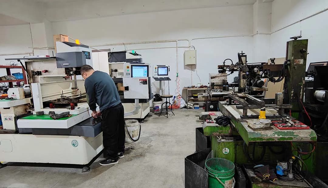 The wire cutting master is cutting the molds.