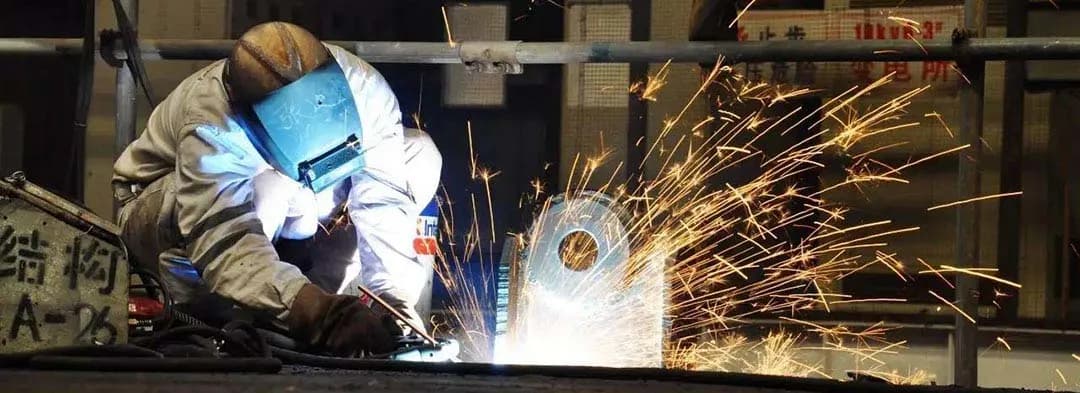 Metal brazing furnace with brazed assemblies on a conveyor.