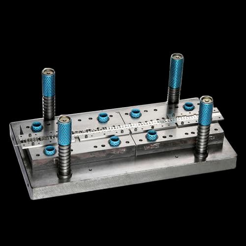 Progressive die stamping press with coil feed in operation.
