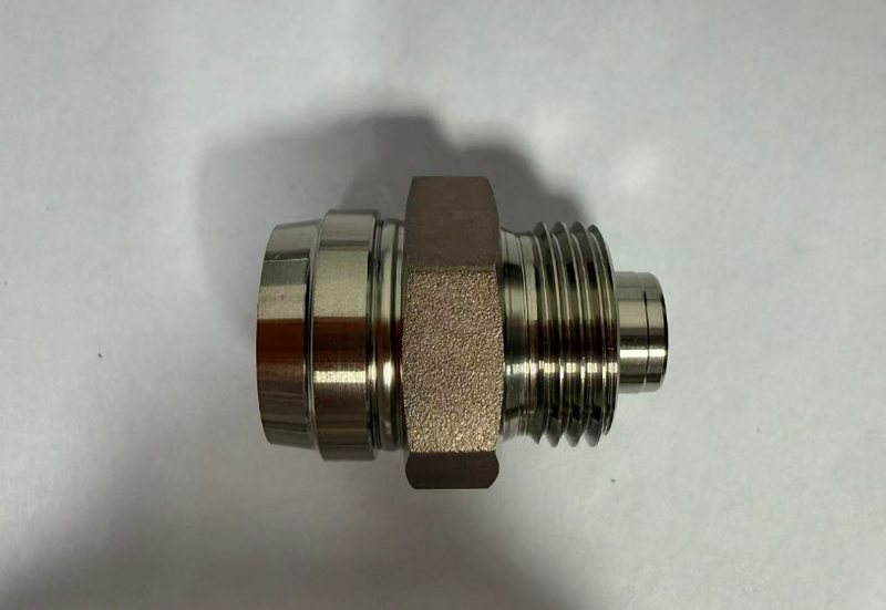 Turned stainless sensor boss with hex flats and machined sealing face