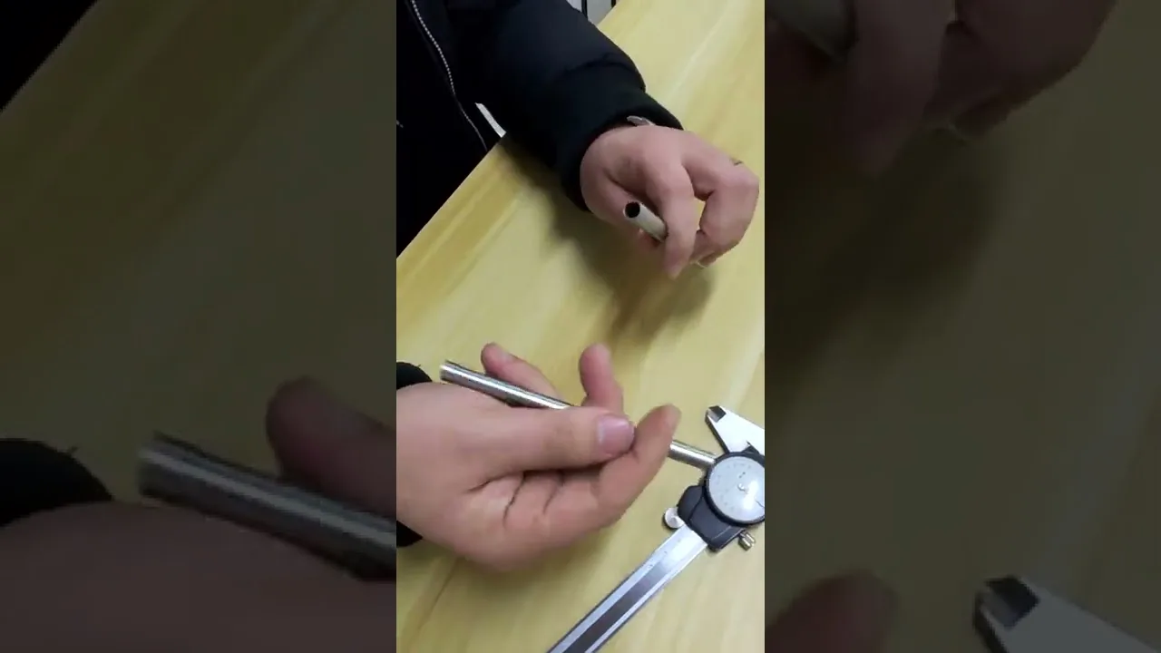Measuring cylindricity on a deep drawn stainless steel tube in the inspection lab.